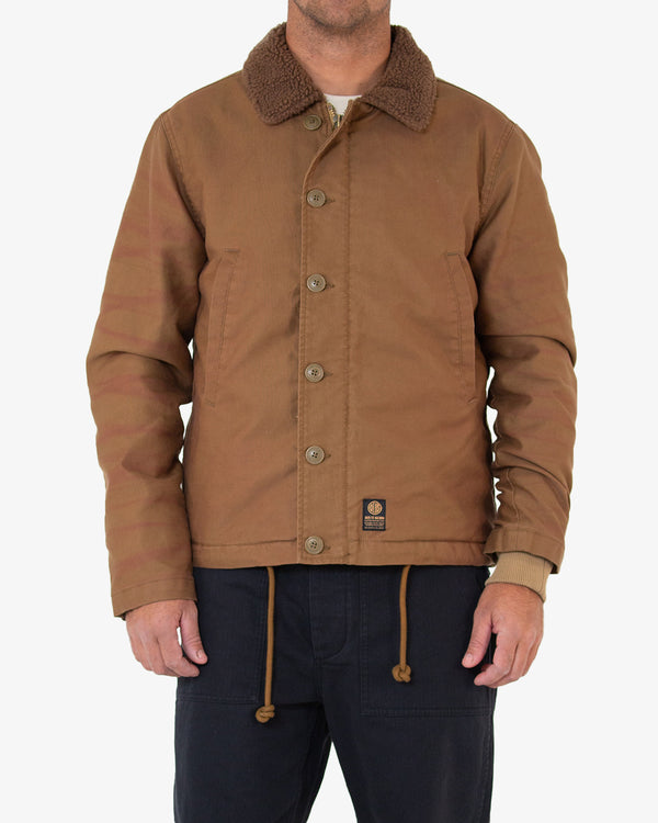tan regular fit jacket with front zip closure and and button placket, cotton rib storm cuffs, lower jet pockets and internal patch pocket, drawstring at the hem and lower hem branded label. 100% cotton whipcord outer shell with sherpa fleece lining with a heavy garment wash.