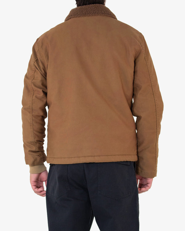 tan regular fit jacket with front zip closure and and button placket, cotton rib storm cuffs, lower jet pockets and internal patch pocket, drawstring at the hem and lower hem branded label. 100% cotton whipcord outer shell with sherpa fleece lining with a heavy garment wash.