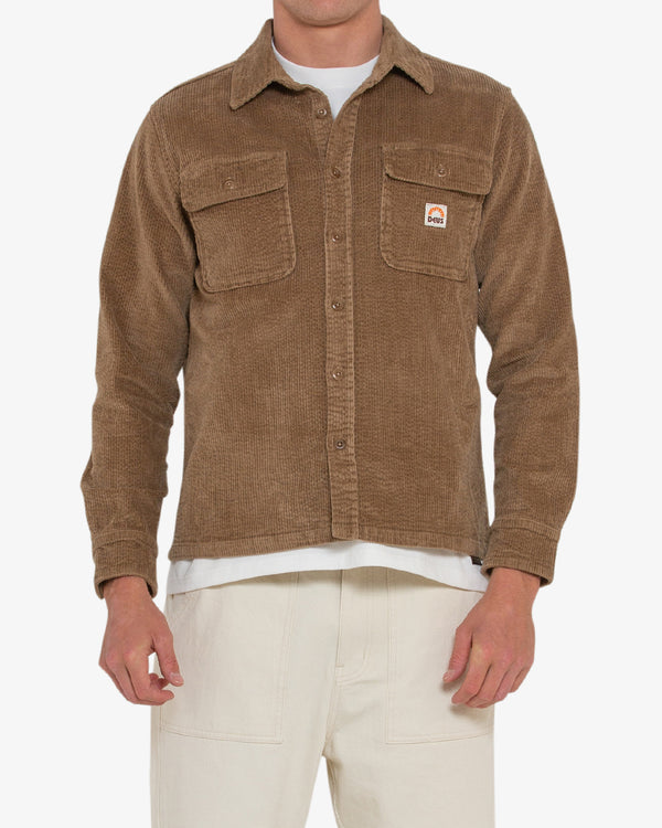 tan regular long sleeve shirt with double chest pockets, woven branded label, 98% cotton 2% elastane fabrication with a heavy enzyme stone wash