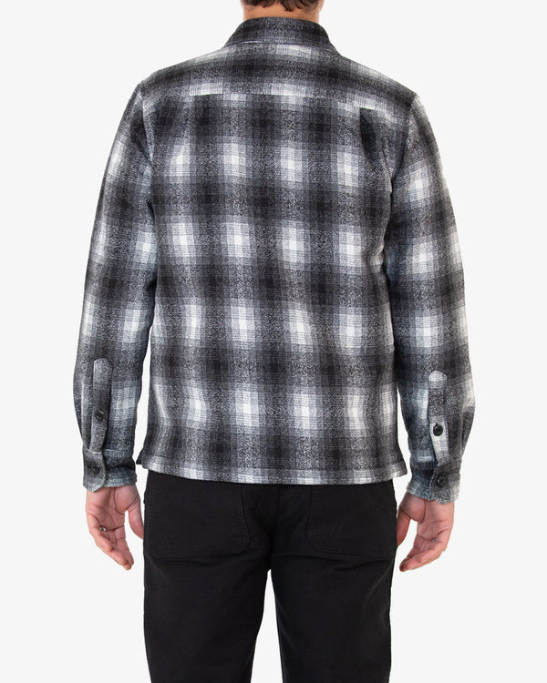 grey relaxed fit overshirt with yarn dyed check and chest branded label, quilted padded lining, wool and poly blend fabrication with light garment wash